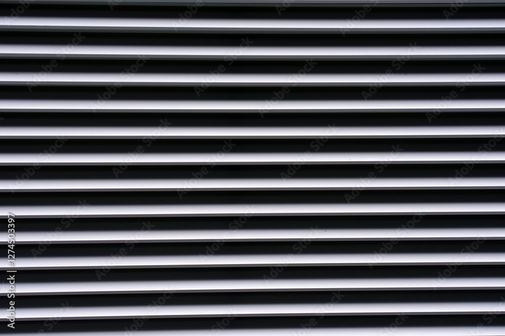 Close-up of metal facade of modern building at Swiss Airport Zürich Kloten on a gray winter day. Photo taken February 17th, 2025, Zurich Kloten, Switzerland. Close-up of metal facade of modern building at Swiss Airport Zürich Kloten on a gray winter day. Photo taken February 17th, 2025, Zurich Kloten, Switzerland.