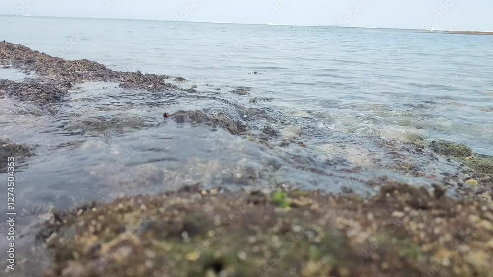 Enjoying the ocean view at Geger beach, Bali. Enjoying the ocean view at Geger beach, Bali.