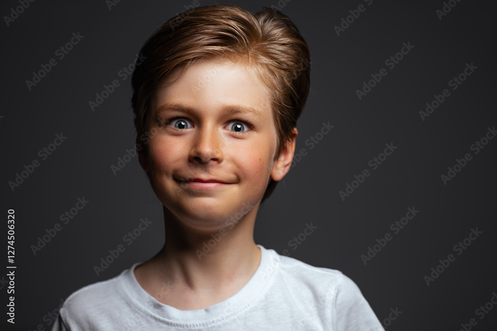 Cute smiling child portrait on dark background Cute smiling child portrait on dark background