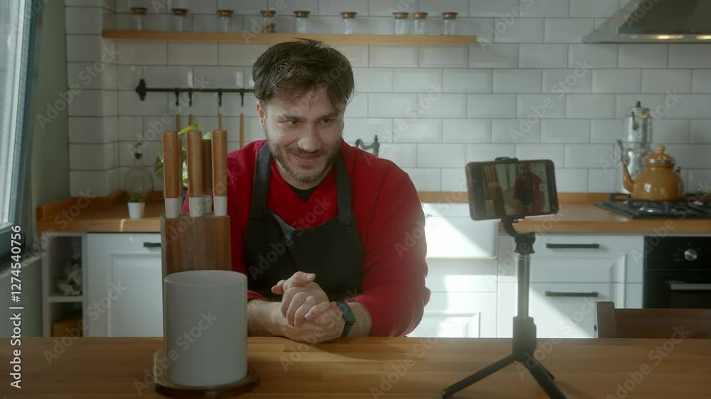 Chef demonstrating knife skills while recording a cooking tutorial Chef demonstrating knife skills while recording a cooking tutorial