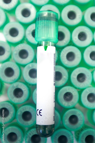 Vacuum tubes for collection and blood samples in medical laboratory with green background