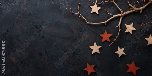Rustic stars and branches on dark textured surface for seasonal decor
