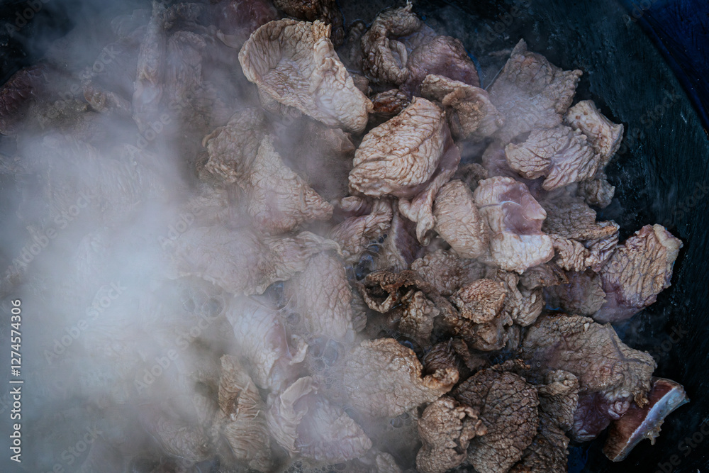 Steaming beef slices simmer in a bubbling broth, releasing rich flavors as they cook. The tender meat absorbs the liquid, creating a delicious dish in progress. Steaming beef slices simmer in a bubbling broth, releasing rich flavors as they cook. The tender meat absorbs the liquid, creating a delicious dish in progress.