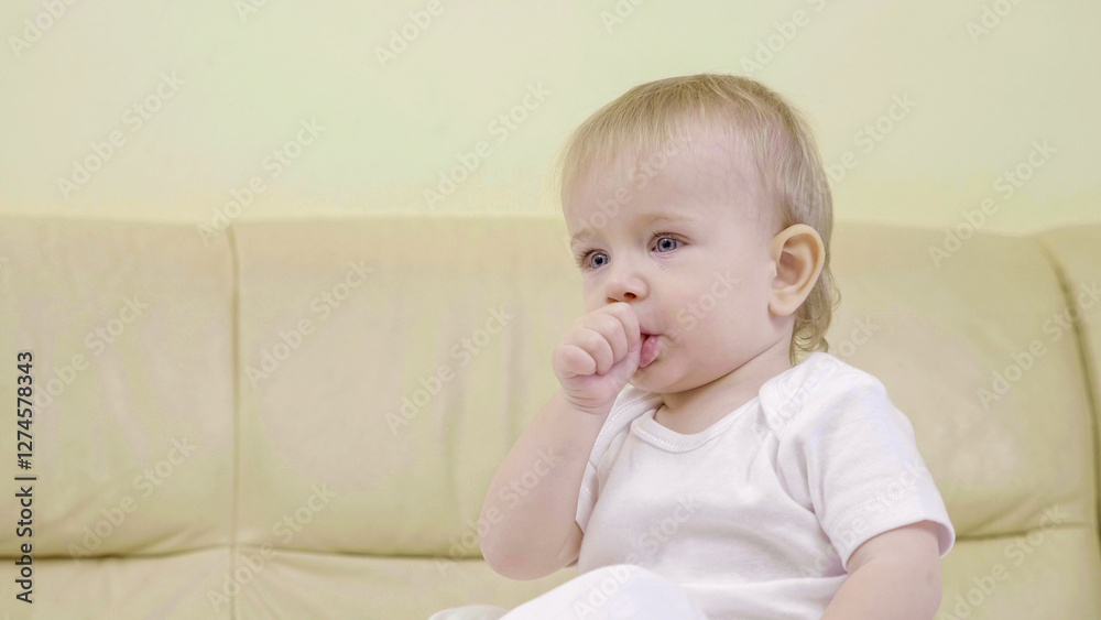 Portrait of baby sucking thumb, bad habit to calm down Portrait of baby sucking thumb, bad habit to calm down