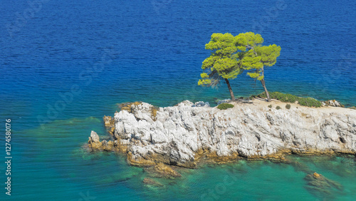 Rock with two pines in the sea, Cape Amarandos Skopelos Island Greece