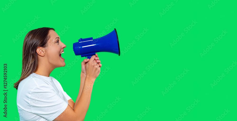 Woman using megaphone to communicate in front of green screen backdrop Woman using megaphone to communicate in front of green screen backdrop