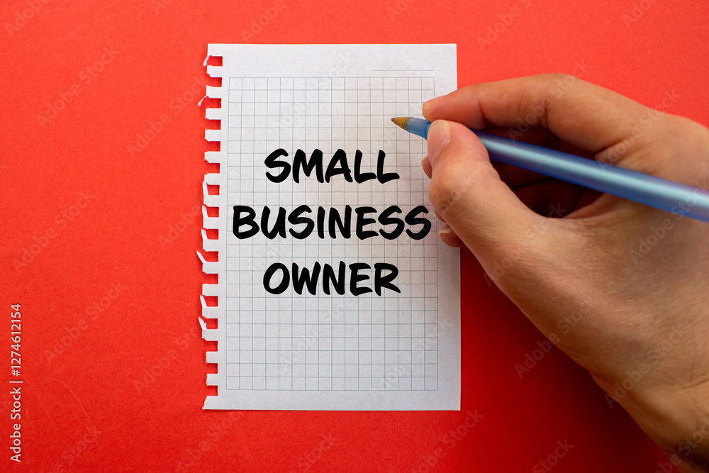 Small business owner message written on white paper on red background. Conceptual small business owner symbol. Copy space. Small business owner message written on white paper on red background. Conceptual small business owner symbol. Copy space.