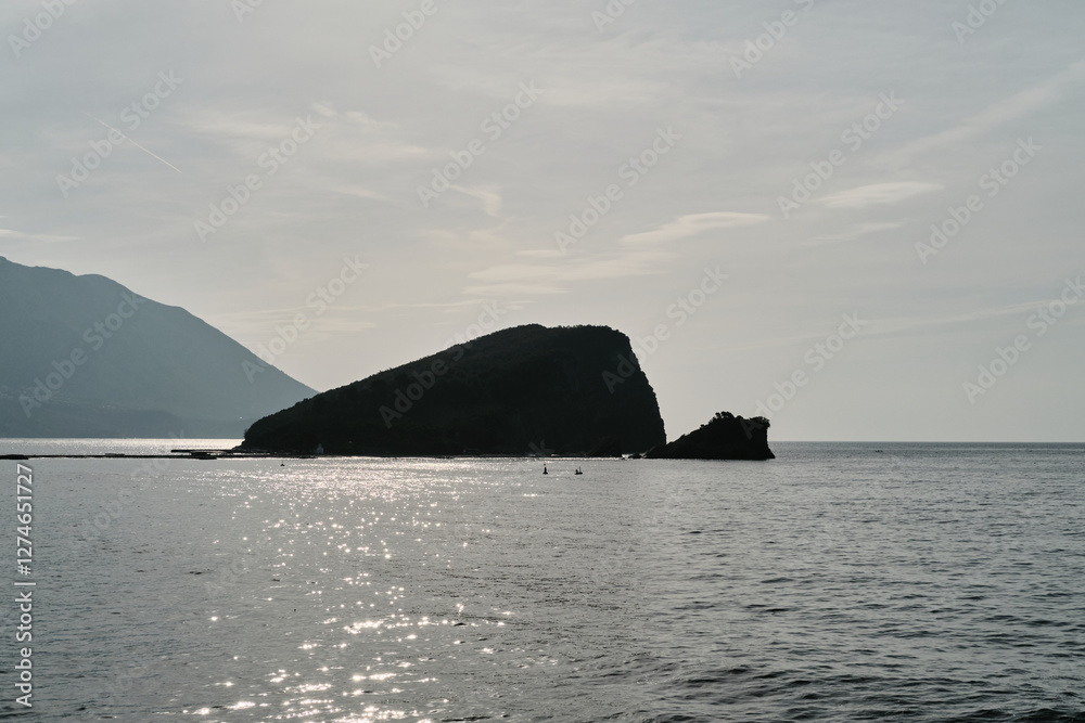 View at St. Nicholas Island near town Budva, famous travel resort in Montenegro, Europe. View at St. Nicholas Island near town Budva, famous travel resort in Montenegro, Europe.