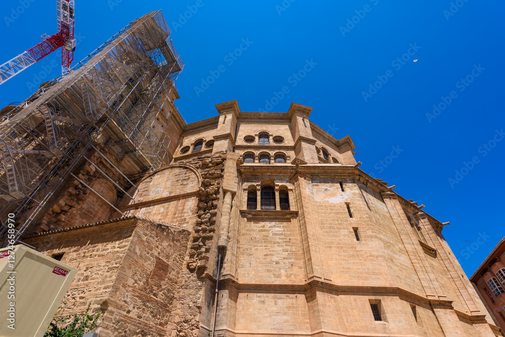 Malaga, Spain - August 06, 2024: View at the Malaga Cathedral or Santa Iglesia Catedral Basílica de la Encarnación, an iconic national landmark ,16th-century baroque facade