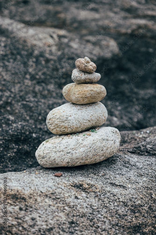 Balanced stones on rocky terrain in serene outdoor setting Balanced stones on rocky terrain in serene outdoor setting