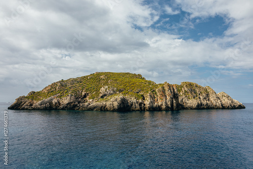 Rocky cliff in small island photo