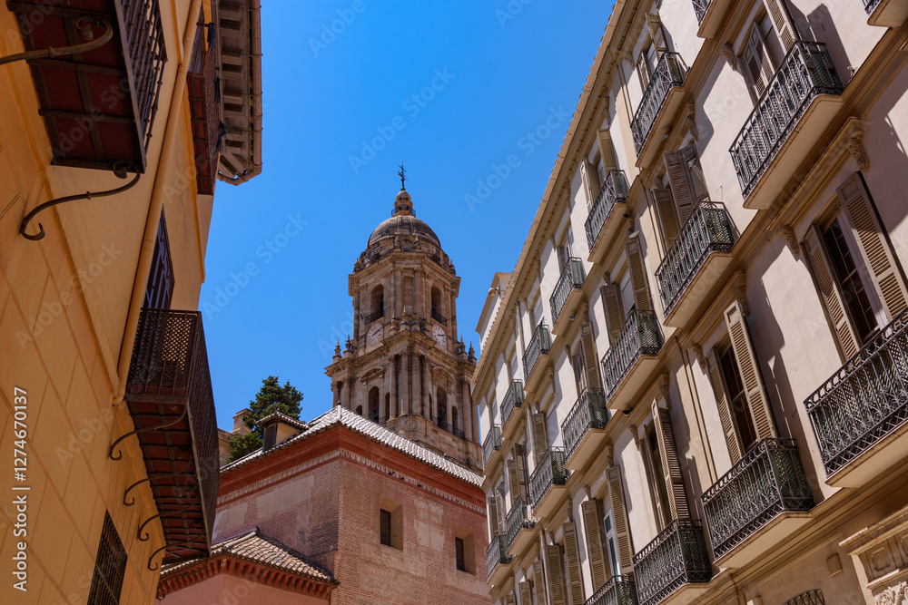 Malaga, Spain - August 06, 2024: View at the Malaga Cathedral or Santa Iglesia Catedral Basílica de la Encarnación, an iconic national landmark ,16th-century baroque facade