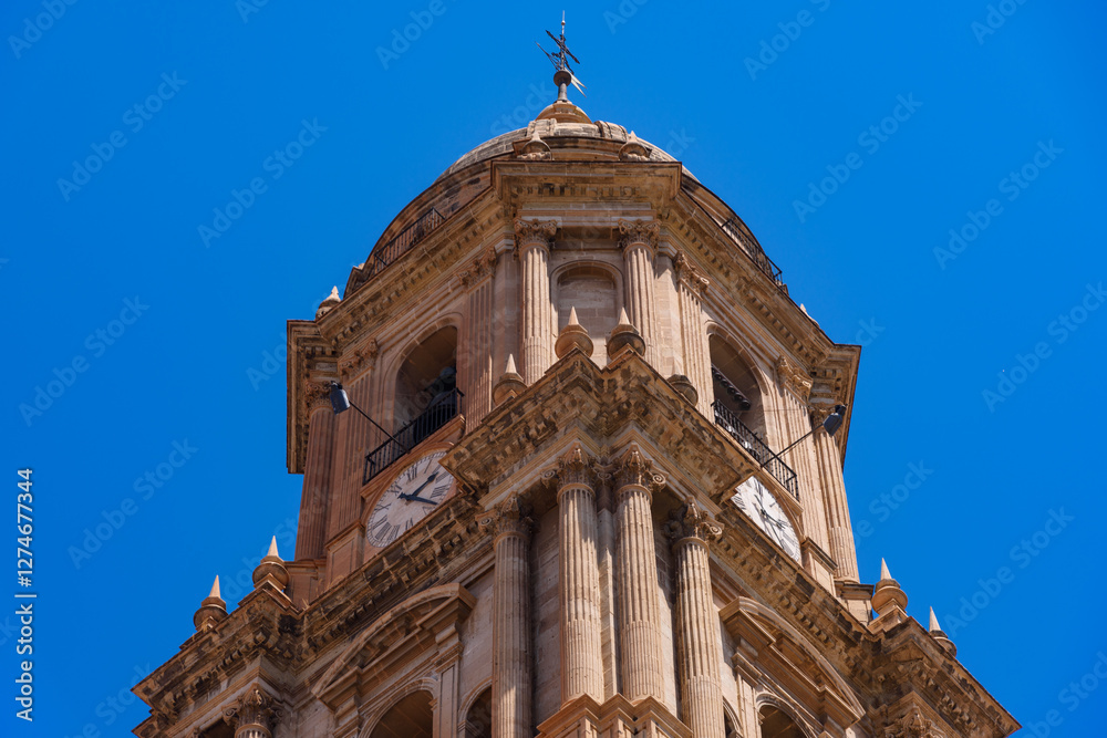 Malaga, Spain - August 06, 2024: View at the Malaga Cathedral or Santa Iglesia Catedral Basílica de la Encarnación, an iconic national landmark ,16th-century baroque facade