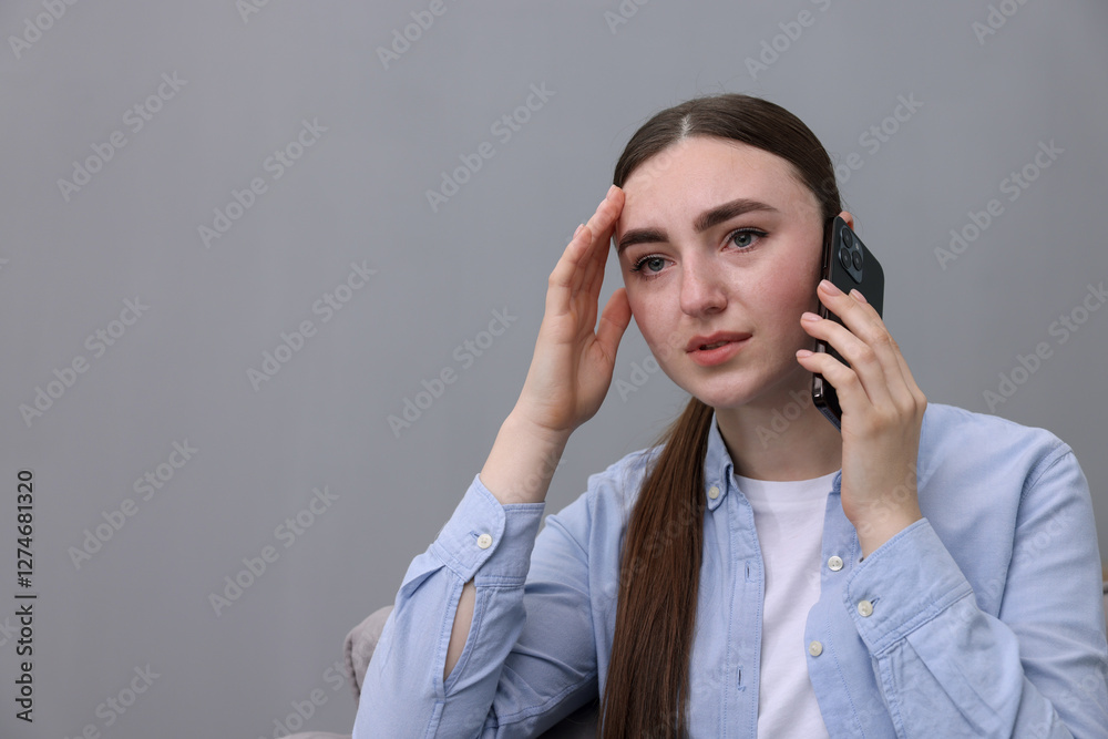 Stressed woman calling hotline for mental health help at home. Space for text Stressed woman calling hotline for mental health help at home. Space for text