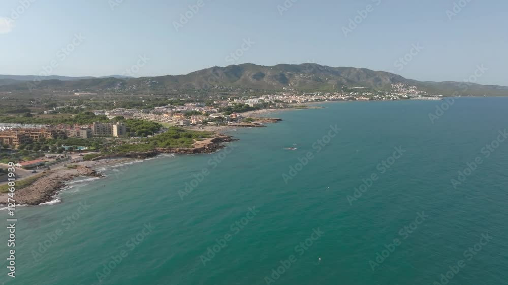 typical Spanish holiday resort on the Mediterranean with beach and cliffs. Aerial view typical Spanish holiday resort on the Mediterranean with beach and cliffs. Aerial view
