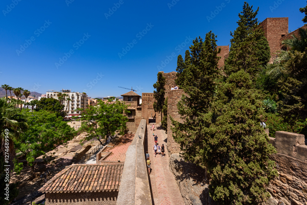 Malaga, Spain - August 06, 2024: Walls and bastion of the castle fort Gibralfaro in Malaga. Castillo de Gibralfaro.