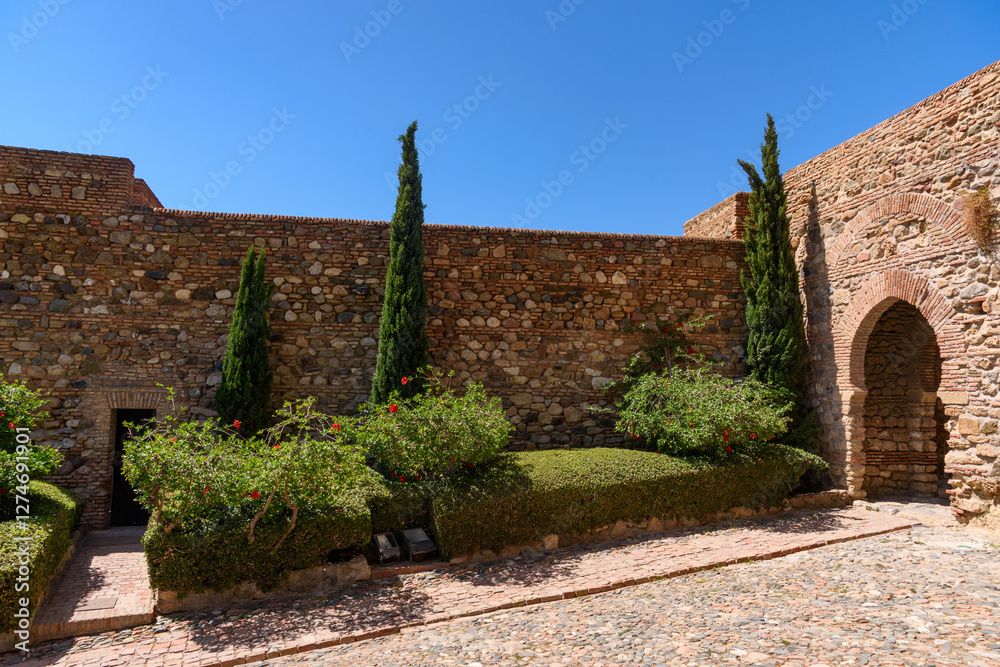 Malaga, Spain - August 06, 2024: Walls and bastion of the castle fort Gibralfaro in Malaga. Castillo de Gibralfaro.