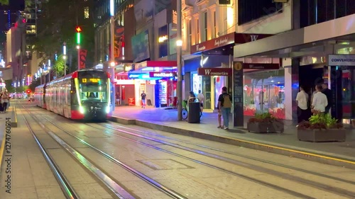 15 February 2025 Tram moving down George St in Sydney NSW Australia with the CBD city lights at Blue Hour