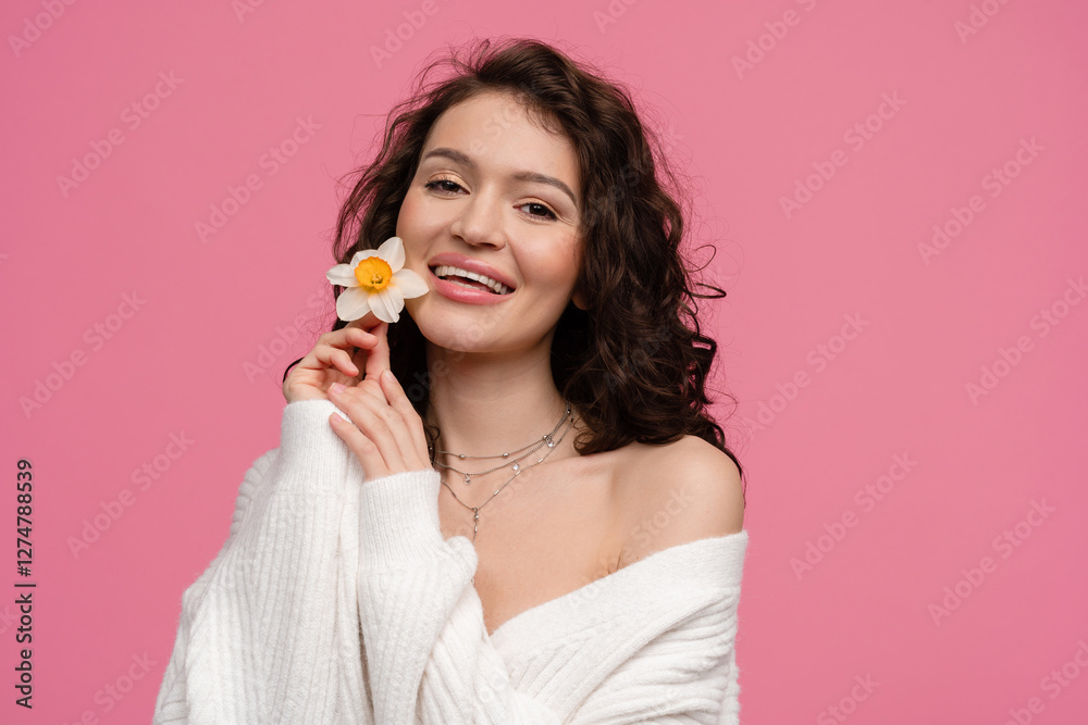 woman on pink background isolated in white knitted sweater holding flower spring summer trend fashion woman on pink background isolated in white knitted sweater holding flower spring summer trend fashion