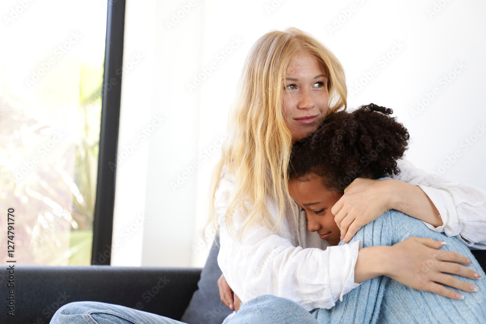 Supportive Hug Between Woman and Girl on the Couch Supportive Hug Between Woman and Girl on the Couch
