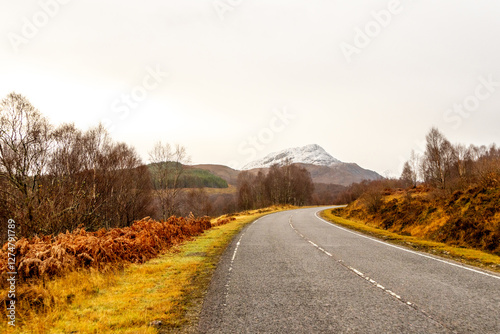 A Scottish Highland Road Taking Vehicles Through The Most Stunning Scenery