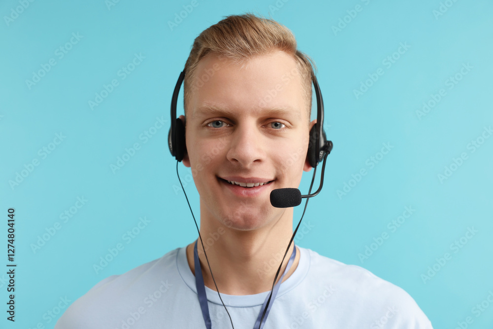 Technical support call center. Portrait of smiling operator on light blue background Technical support call center. Portrait of smiling operator on light blue background