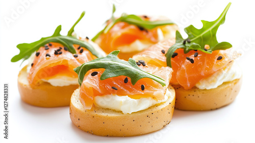 Smoked salmon and cream cheese bagel with arugula isolated on white background.