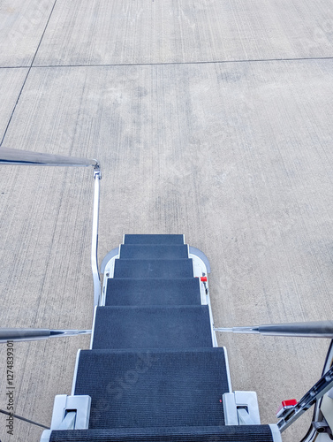 A Private Jet's Stairs Are Deployed And Awaiting Their Passengers To Get On Or Off photo