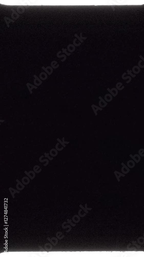 Real Vintage Film Light Leak Overlay with Grain, Soft Glowing Edges, and Analog Texture for Vertical Video Background Compositing. FL0052