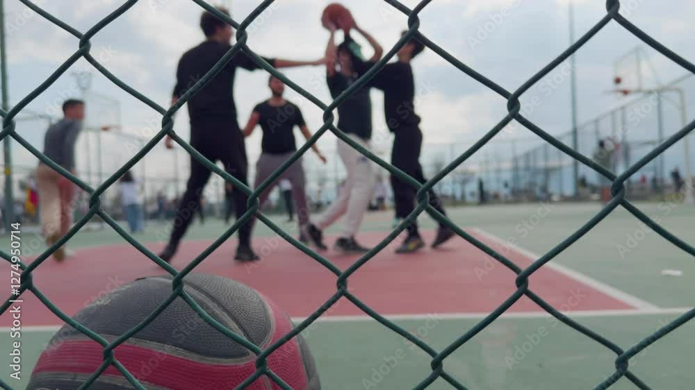 Blurry Basketball Sport Game Players Behind the Metal Fence Blurry Basketball Sport Game Players Behind the Metal Fence