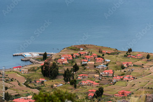 typical houses of the island of amantani in puno peru photo