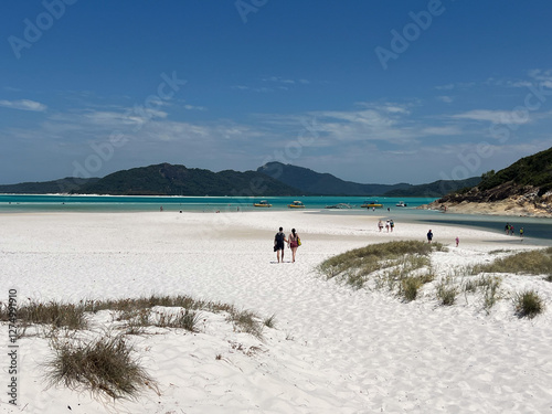 Large group of tourists visit at Whitehaven beach on Whitsunday Islands Queensland Australia photo