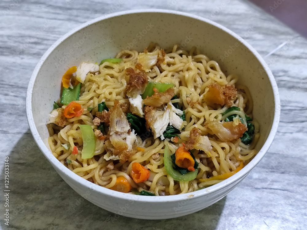 Soy sauce fried noodles served with pickles, chilies, vegetables, etc. Soy sauce fried noodles served with pickles, chilies, vegetables, etc.