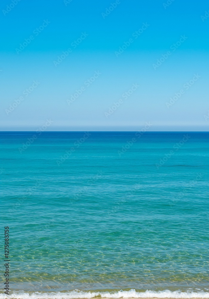 Calm Turquoise Ocean Meets Blue Sky on Sunny Summer Day Calm Turquoise Ocean Meets Blue Sky on Sunny Summer Day
