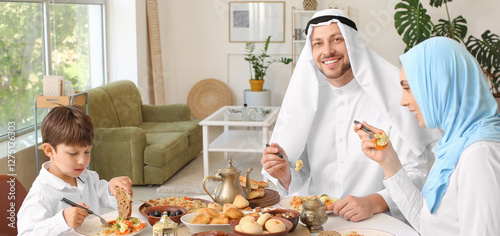 Muslim family having breakf...