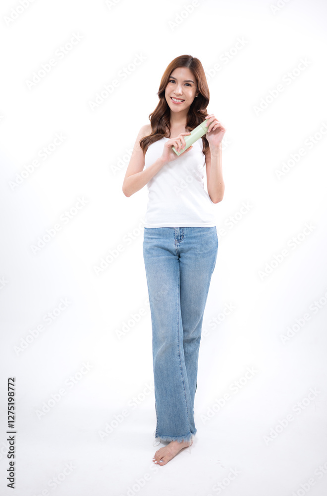 A portrait of a young Asian woman posing in a studio A portrait of a young Asian woman posing in a studio
