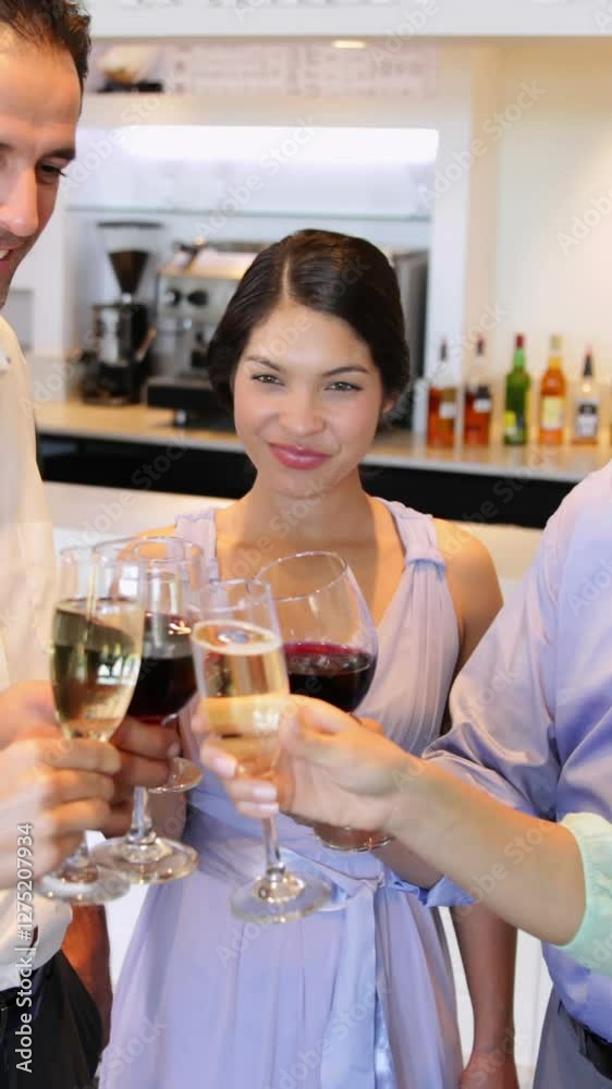 Attractive friends chatting together and toasting their drinks Attractive friends chatting together and toasting their drinks