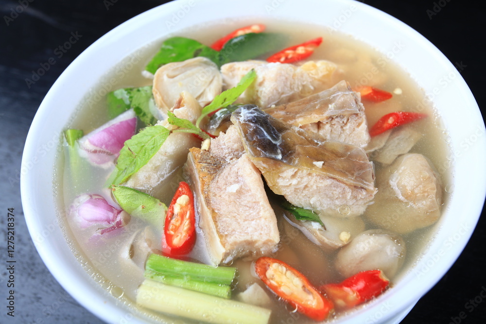 Tom Yum Pla Jok (Cyclocheilichthys) or Soldier River barb spicy soup the local fish of the Mekong River Tom Yum Pla Jok (Cyclocheilichthys) or Soldier River barb spicy soup the local fish of the Mekong River