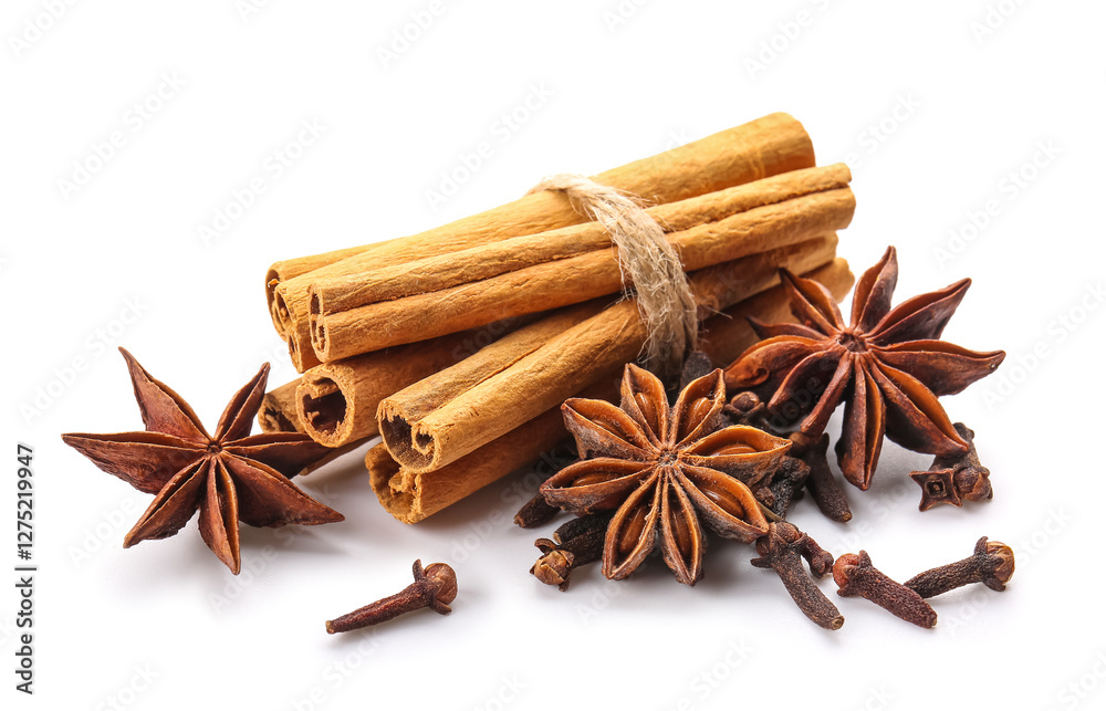 Star anise with cinnamon sticks and cloves on white background Star anise with cinnamon sticks and cloves on white background
