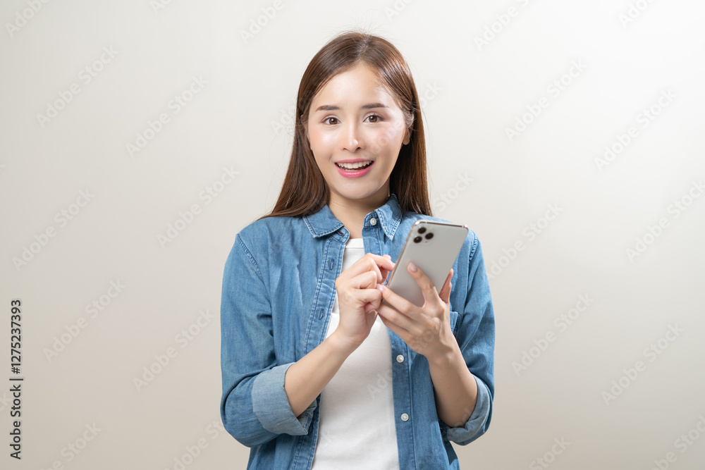 Happy asian young woman using mobile smart phone, read good news online, laugh excited getting offer, great positive surprise, celebrate success on smartphone. Smile girl isolated on white background. Happy asian young woman using mobile smart phone, read good news online, laugh excited getting offer, great positive surprise, celebrate success on smartphone. Smile girl isolated on white background.