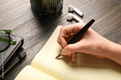 Woman writing something in ...
