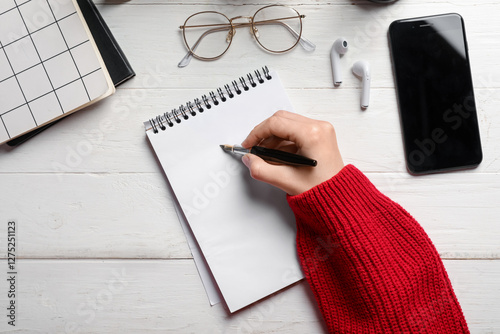Woman writing something in ...