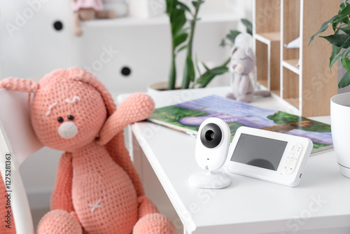 Baby monitor on table in ch...