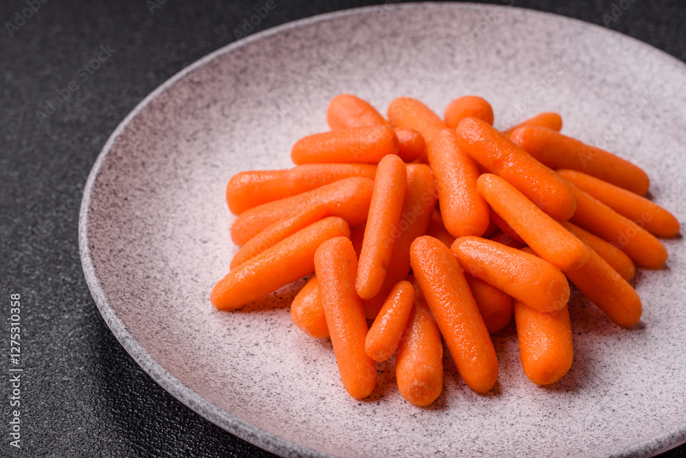 Raw peeled mini baby carrots as an ingredient for preparing a vegetarian food Raw peeled mini baby carrots as an ingredient for preparing a vegetarian food