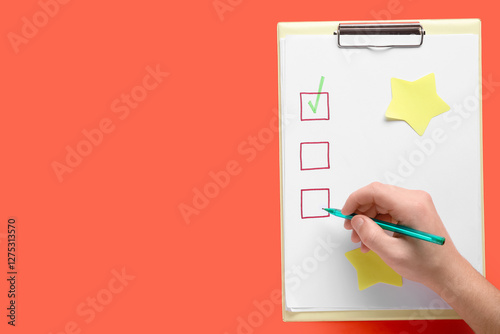 Hand checking off checklist...