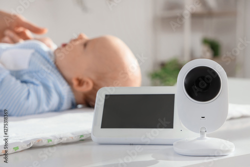 Baby monitor on changing ta...