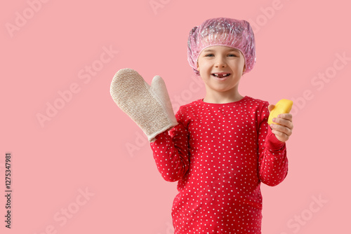 Little girl in shower cap w...