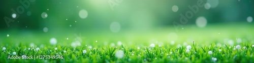 Fresh snowflakes gently falling on a green field, white, peaceful, winter