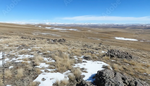Expansive High Altitude Winter Landscape with Distant Mountains