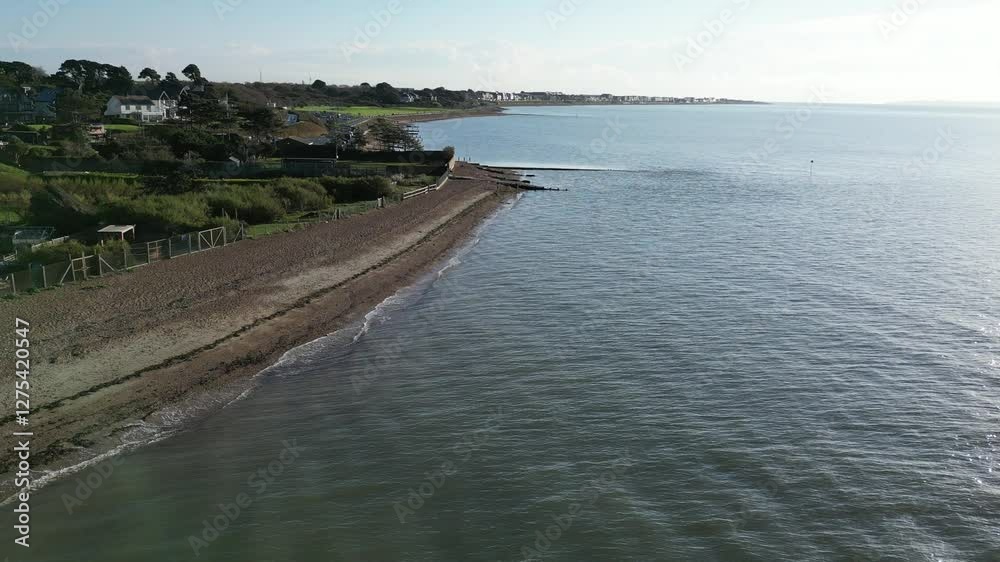 custom made wallpaper toronto digitalAerial drone shot of wooden groynes on beach along south coast of England, with sea and shoreline stretching in the background.